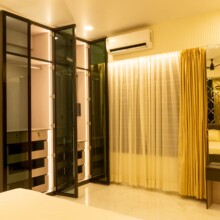 High-End Villas in Vasai – Ivy Dreamland, Starting at ₹4.5 Cr a room with a bed and a mirror at Ivy Dreamland