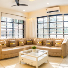 a living room with a couch and a coffee table - Project Ivy Dreamland